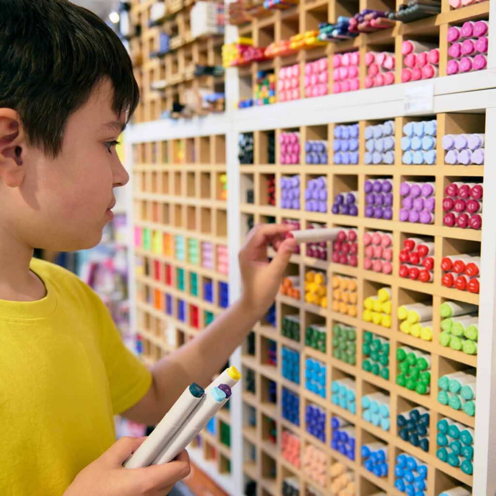 boy shopping for school supplies